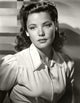 Gene Tierney wearing a collared outfit - vintage photo print
