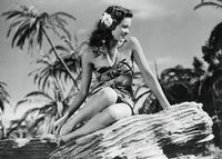 Gene Tierney Sitting Sideways on Rocks Photo Print