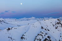 The Moon Rises Over Snowy Mountain Ridges in Alaska by Steven Miley - Fine Art Print