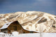 Steamboat Barn and Snow-Covered Mountains Poster Print by Ron Dahlquist