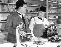 Tit For Tat Poster Print featuring Oliver Hardy and Stan Laurel (1935)