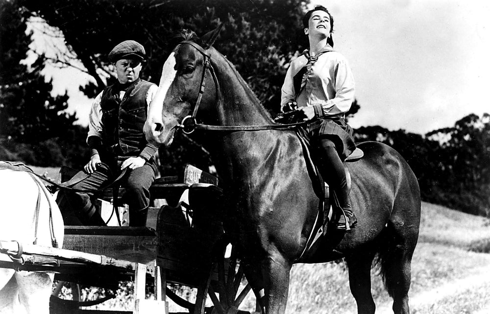 Mickey Rooney and Elizabeth Taylor riding a horse in National Velvet photo print.