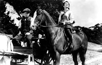 Mickey Rooney and Elizabeth Taylor riding a horse in National Velvet photo print.