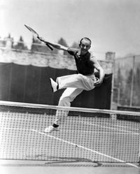 Fred Astaire leaping over a tennis net, photo print