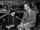 Fred Astaire seated in suit photo print, classic Hollywood elegance.