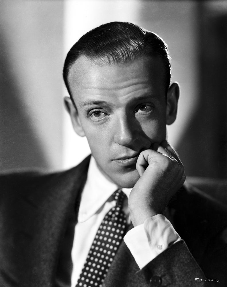 Fred Astaire leaning on hand in bored gesture photo print.