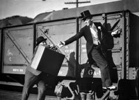 Fred Astaire Riding a Train Photo Print showcasing classic Hollywood charm.
