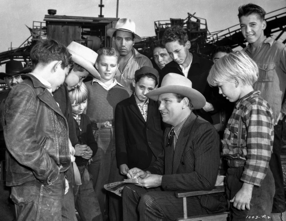 Gene Autry surrounded by a crowd photo print