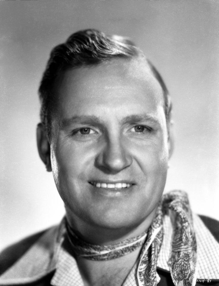 Close-up portrait photo print of Gene Autry smiling.