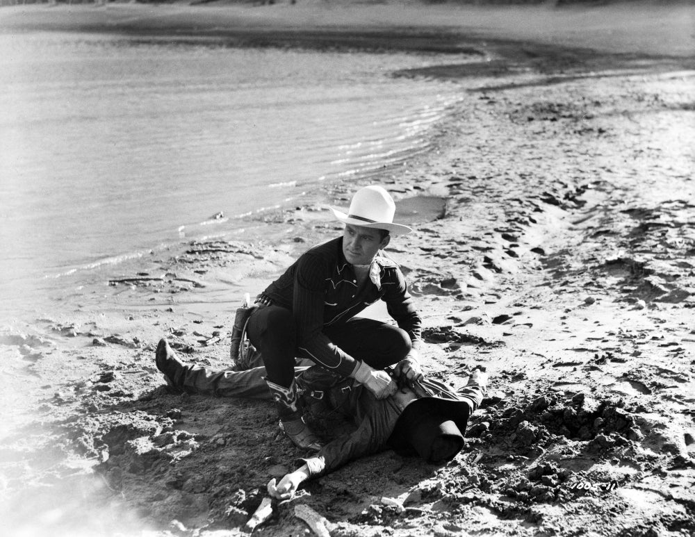 Gene Autry Looting on a Dead Man Photo Print showcasing a classic Western scene.