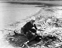 Gene Autry Looting on a Dead Man Photo Print showcasing a classic Western scene.