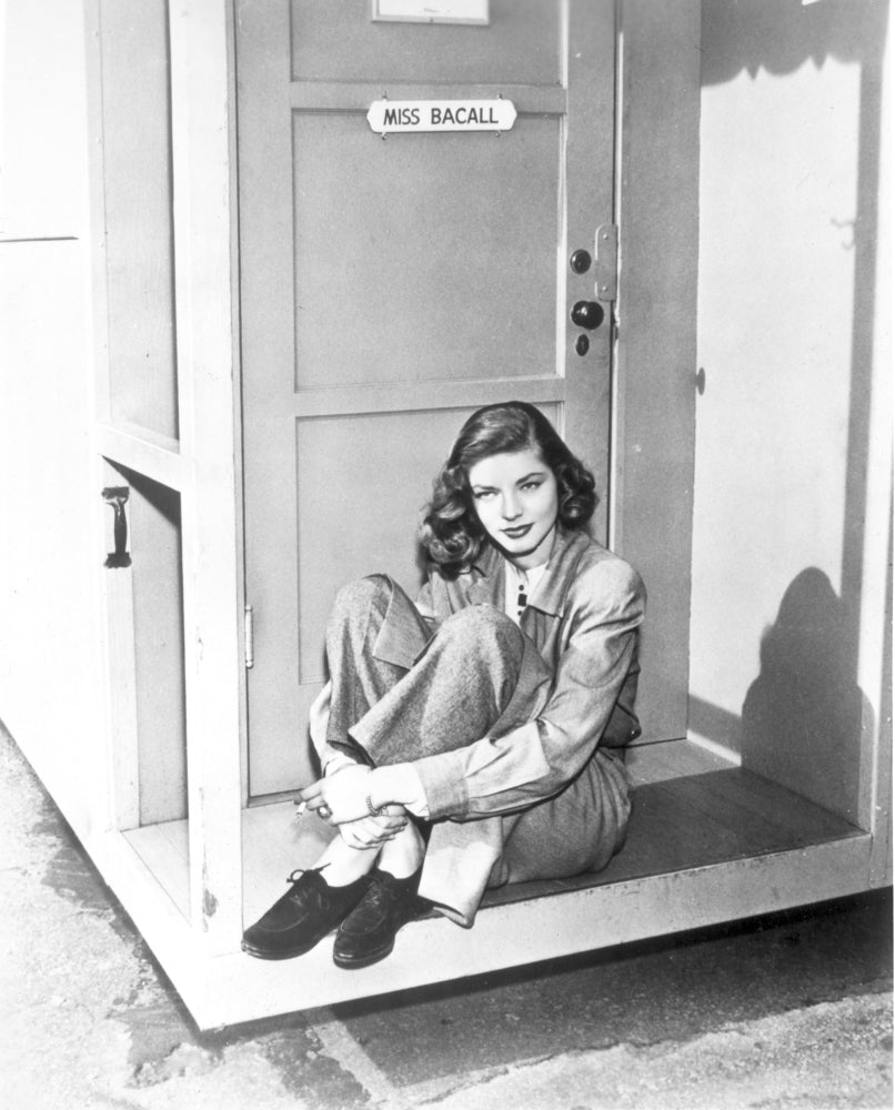 Lauren Bacall sitting outside her door photo print