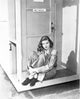 Lauren Bacall sitting outside her door photo print