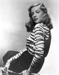 Lauren Bacall looking over her shoulder photo print, capturing Hollywood elegance.