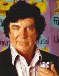 Alan Bates posed in a black suit photo print.