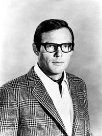 Adam West photo print featuring the iconic actor wearing glasses.