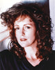 Close-up portrait photo print of Bonnie Bedelia smiling in a black shirt.