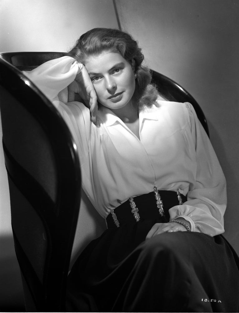 Ingrid Bergman in an armchair photo print showcasing classic Hollywood elegance.
