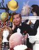 Milton Berle portrait photo print in tuxedo surrounded by cartoons.