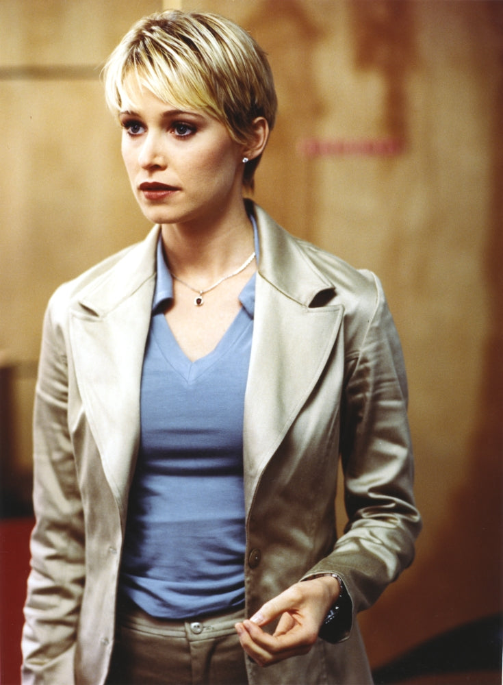 Josie Bissett posed in glossy coat and blue shirt portrait photo print