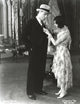 Gracie Allen helping George Burns to dress photo print