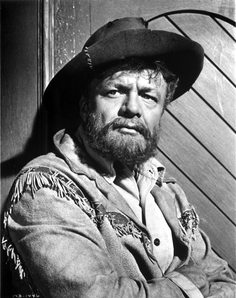 Photo print of Brian Keith wearing a cowboy costume, vintage style.