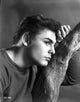 John Saxon Photo Print featuring him with a branch, perfect for film enthusiasts.