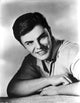 John Saxon smiling photo print, capturing the charm of a Hollywood icon.