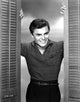 John Saxon smiling photo print capturing classic cinema charm.