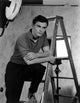 John Saxon photo print featuring a ladder, iconic cinematic moment.