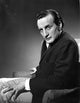 George C. Scott sitting in an armchair photo print