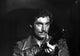 Timothy Dalton with a gun photo print showcasing the iconic actor.