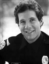 Steve Guttenberg wearing a police badge photo print