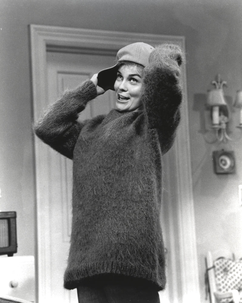 Classic portrait photo print of Ann Margret wearing a sweater and bull cap.
