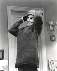 Classic portrait photo print of Ann Margret wearing a sweater and bull cap.
