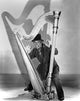 Marx Brothers Cast Playing Harp Photo Print showcasing classic cinema charm.