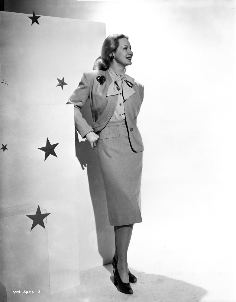 Virginia Mayo Leaning on Wall Photo Print showcasing classic Hollywood elegance.