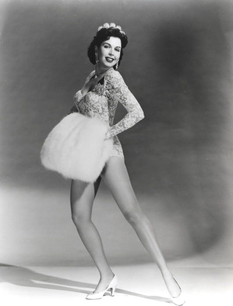 Ann Miller holding a fur muff photo print in vintage style.