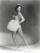 Ann Miller holding a fur muff photo print in vintage style.