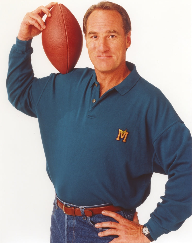 Craig Nelson portrait photo print in blue polo with football.