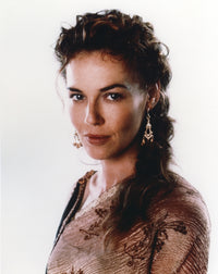 Connie Nielsen photo print in brown dress with white background.