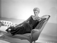 Kim Novak portrait photo print lying on a bench in a black gown.