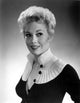 Kim Novak high collar photo print in elegant black and white style.