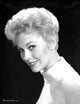 Kim Novak smiling photo print with black background