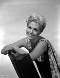 Black and white photo print of Kim Novak lying on a chair