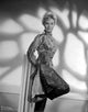 Black and white photo print of Kim Novak posed in an elegant gown.