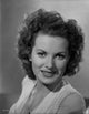 Maureen O'Hara close-up portrait smiling with a necklace.