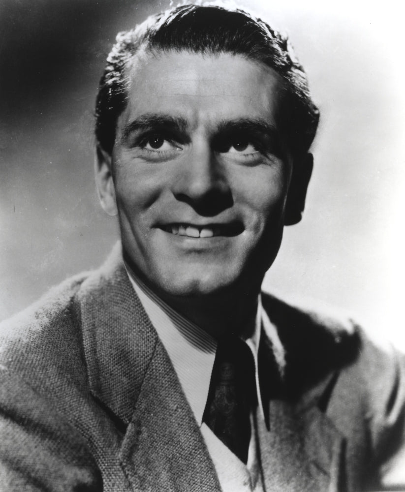 Laurence Olivier smiling photo print showcasing classic Hollywood charm.