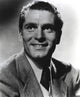 Laurence Olivier smiling photo print showcasing classic Hollywood charm.