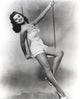 Debra Paget on a swing photo print featuring classic Hollywood charm.